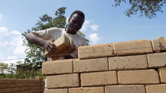 young man building a wall
