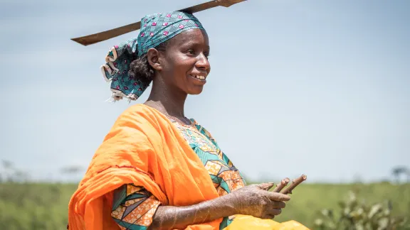 Woman in Cameroon carrying a sword on her head