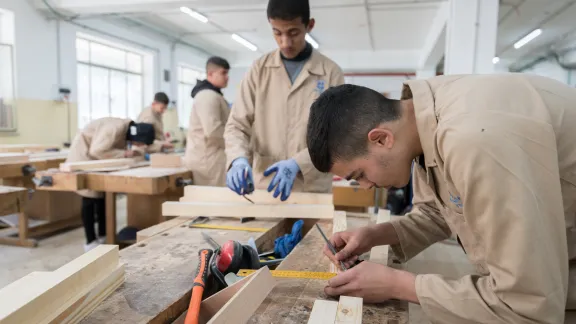 21 January 2023, Ramallah, Palestine: Carpentry students take measurements during a class taught at the LWF Vocational Training Centre in Ramallah.